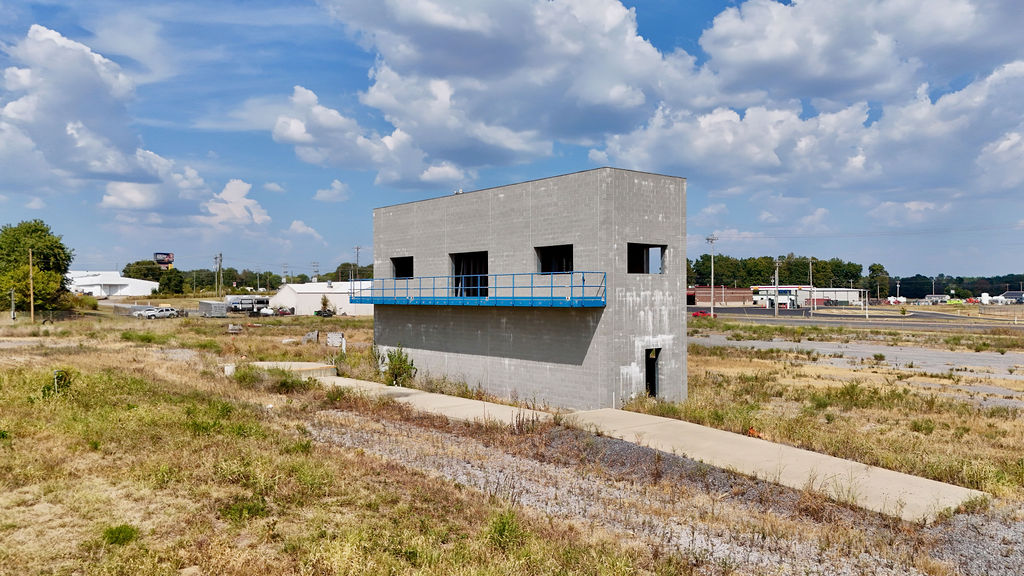 Two-story concrete structure with an exterior platform